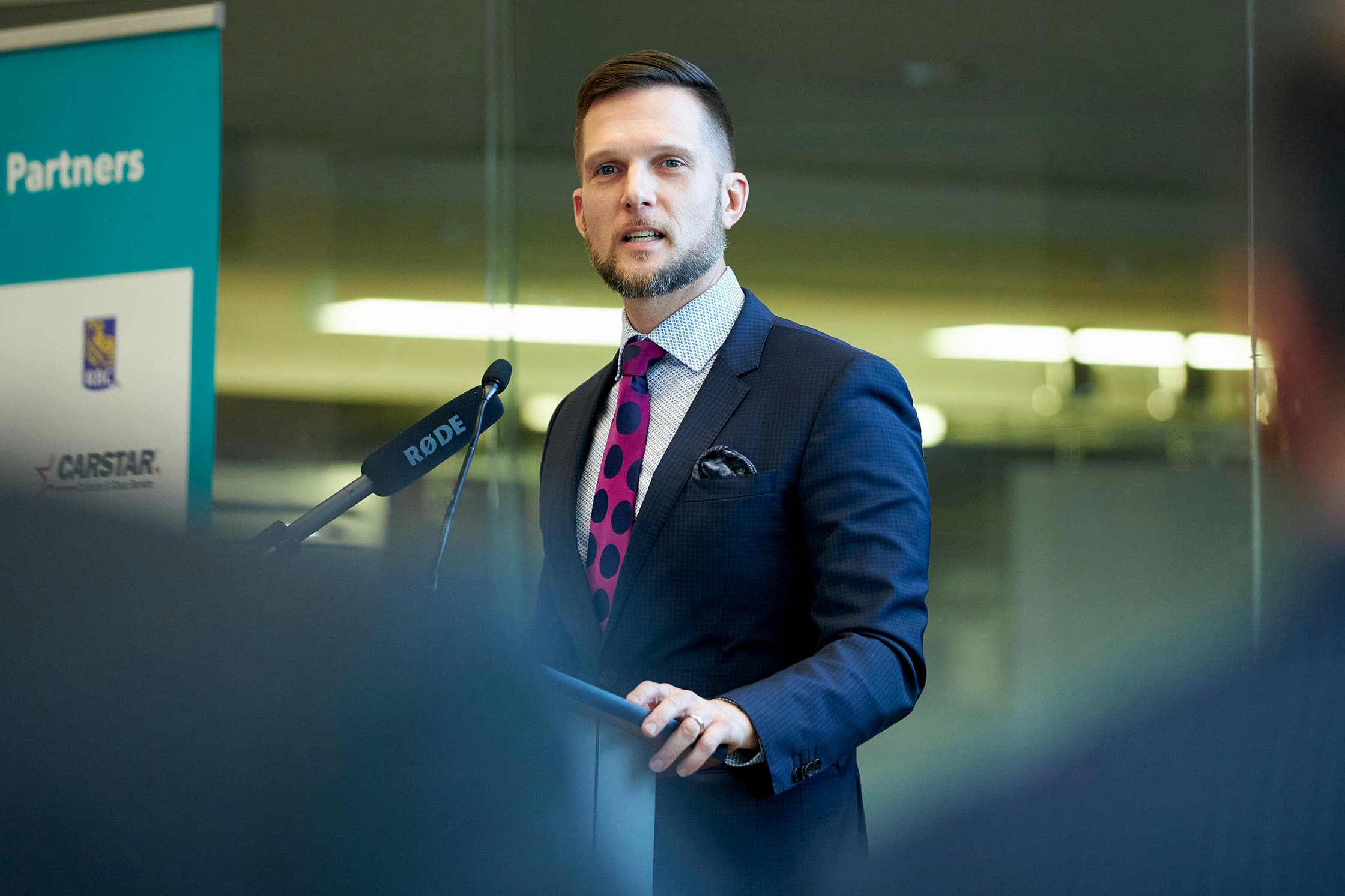 Keanin talking at a podium